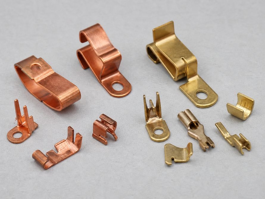 Brass vs Copper for Stamped Metal Parts 2 Brass and copper stamped electrical contacts and clips
