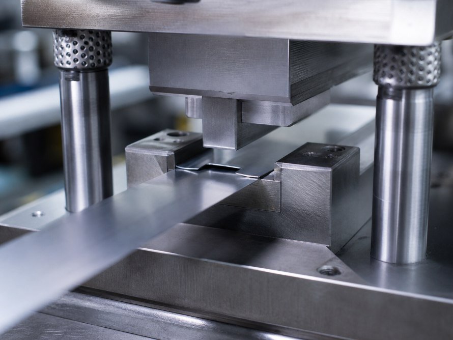 Close-up of tooling used in a stainless steel stamping process