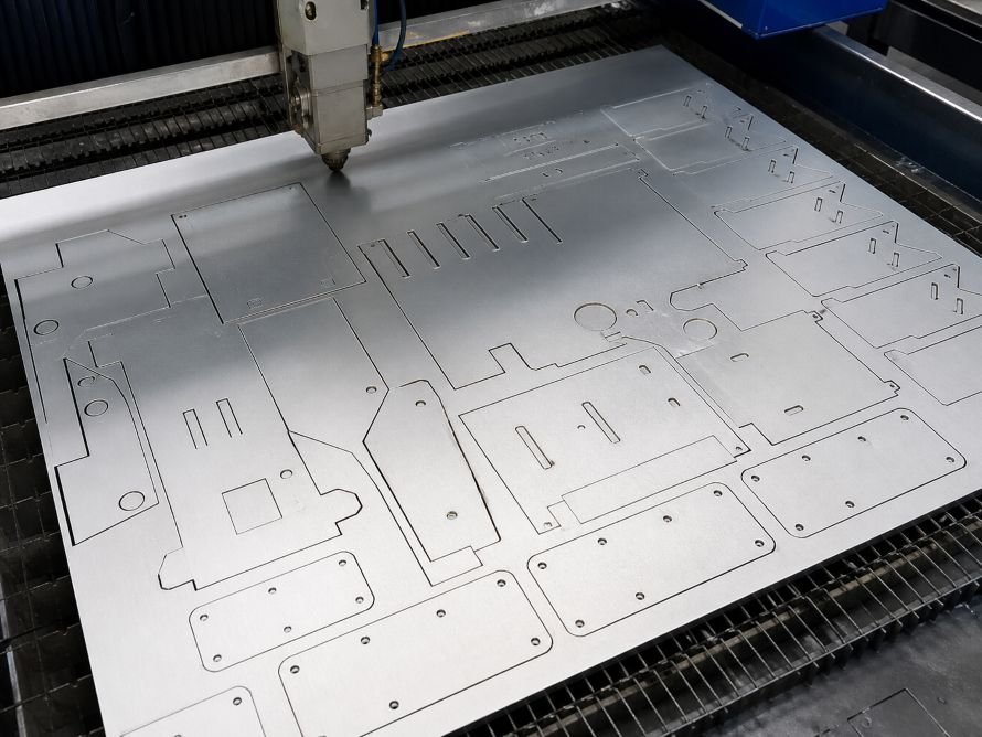 Laser cutting flat sheet metal blanks with nested bracket and panel profiles